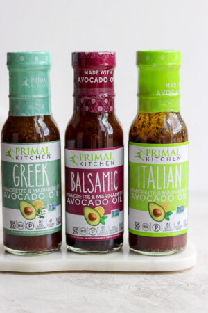 Three jars of Primal Kitchen dressing.